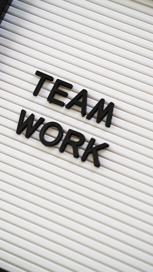 Image of letters showing the word "Team work"